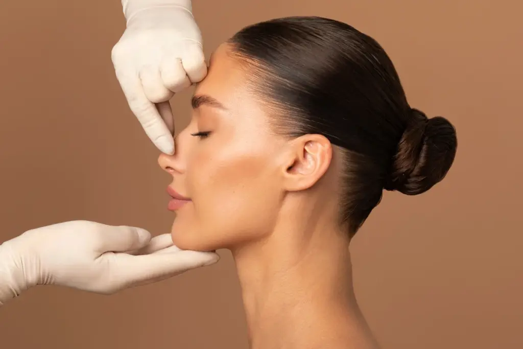 Patient consultation for correcting a drooping nose tip with liquid rhinoplasty
